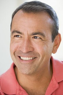 Smiling man in pink