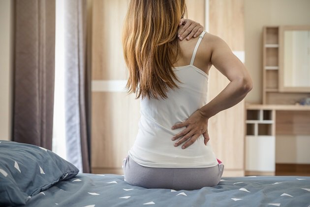 Woman with neck and back pain