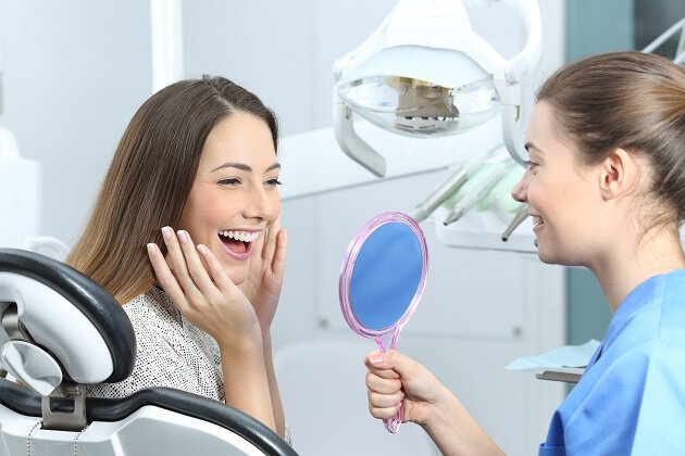 Woman smiling at her reflection